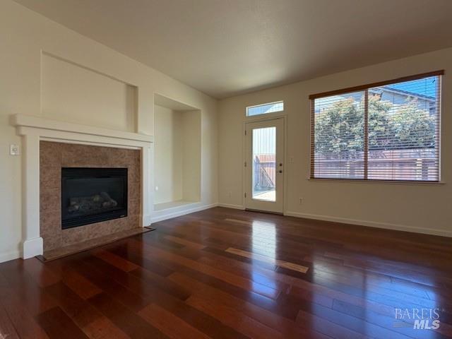 1545 Jainine Street Santa Rosa, CA 95403 - Photo 14 of 19 a view of an empty room with wooden floor fireplace and a window