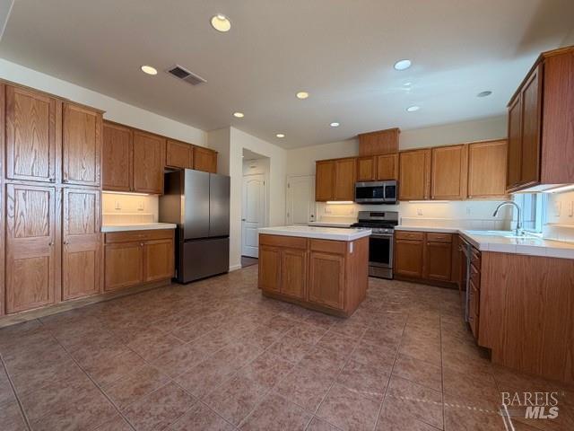 1545 Jainine Street Santa Rosa, CA 95403 - Photo 16 of 19 a kitchen with stainless steel appliances granite countertop a refrigerator sink and cabinets
