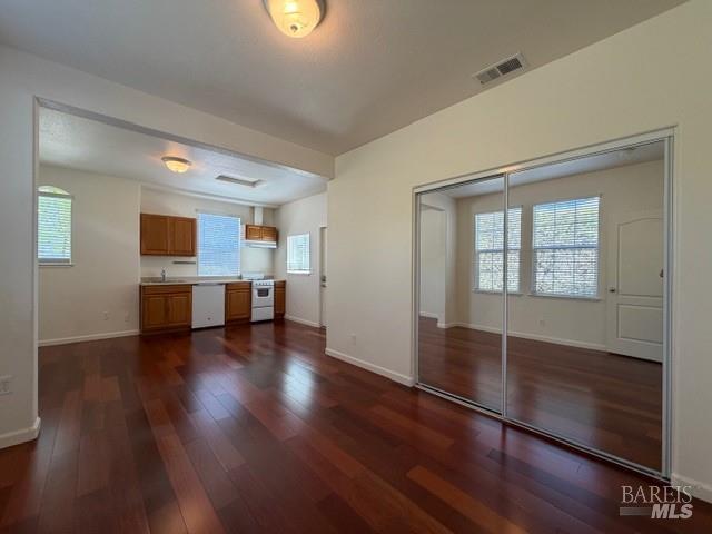 1545 Jainine Street Santa Rosa, CA 95403 - Photo 17 of 19 a view of empty room with wooden floor and windows