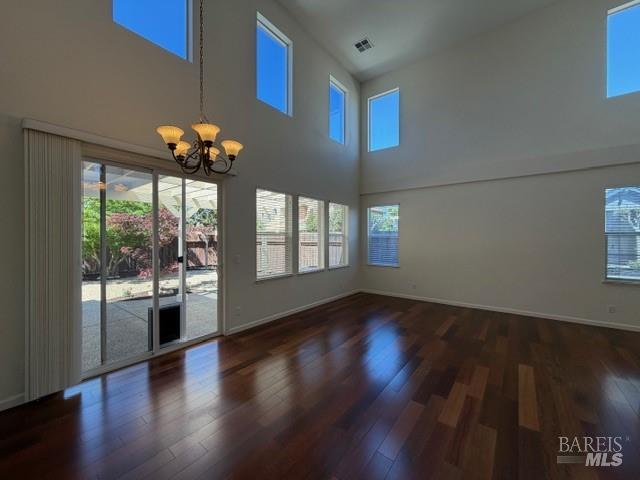 1545 Jainine Street Santa Rosa, CA 95403 - Photo 7 of 19 a view of an empty room with wooden floor and a window