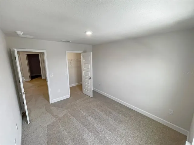 an empty room with a bathroom