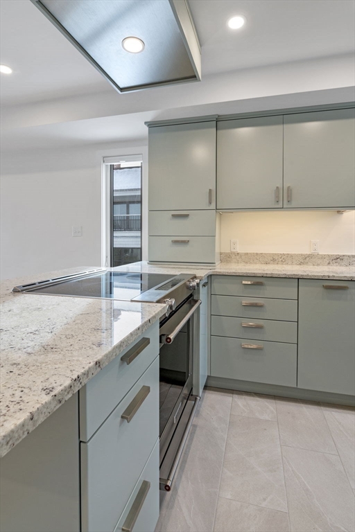34 Constitution Way, Unit D Marblehead, MA 01945 - Photo 11 of 33 a kitchen with a stove and a sink