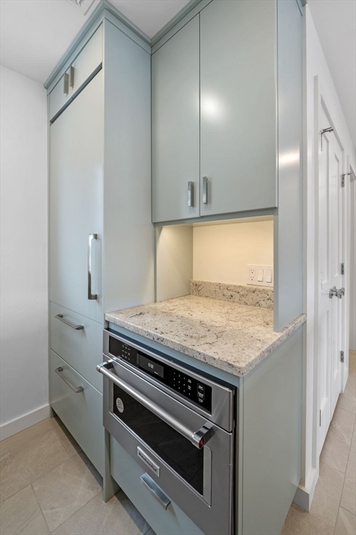 34 Constitution Way, Unit D Marblehead, MA 01945 - Photo 14 of 33 a kitchen with a stove and a granite counter top
