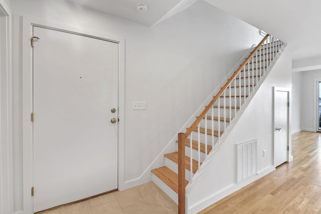 34 Constitution Way, Unit D Marblehead, MA 01945 - Photo 18 of 33 a view of staircase with wooden floor and white walls