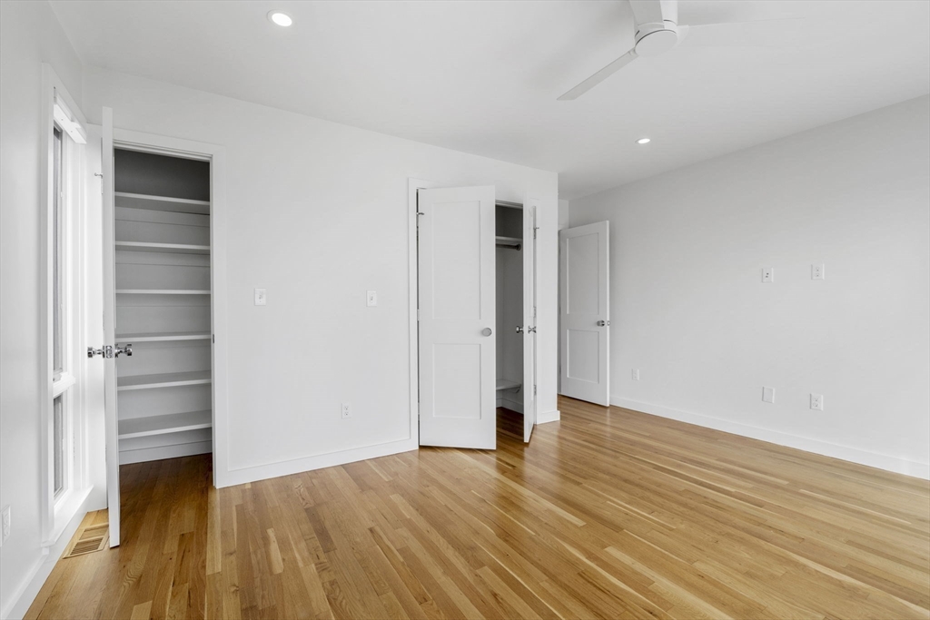 34 Constitution Way, Unit D Marblehead, MA 01945 - Photo 22 of 33 a view of an empty room with wooden floor