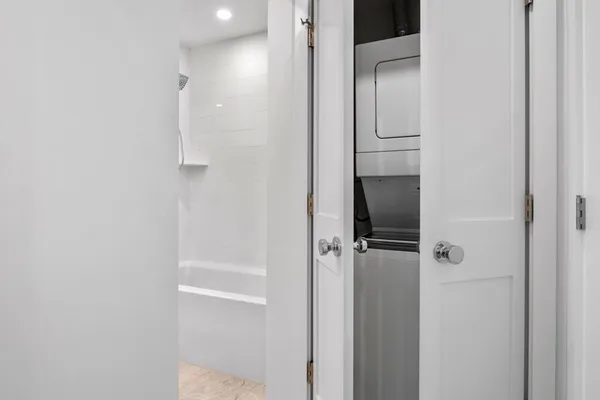a bathroom with a shower and a sink