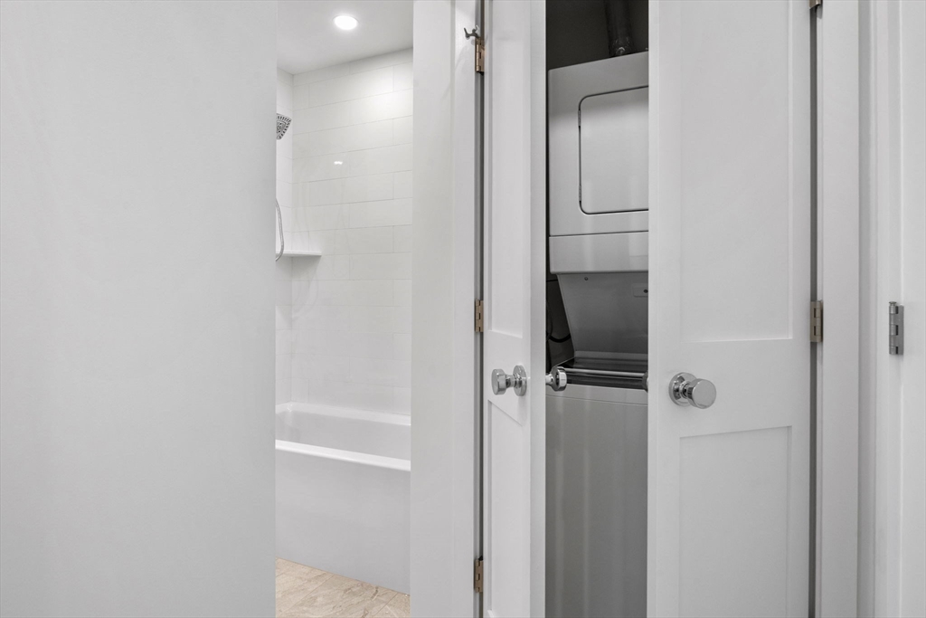 34 Constitution Way, Unit D Marblehead, MA 01945 - Photo 26 of 33 a bathroom with a glass shower door