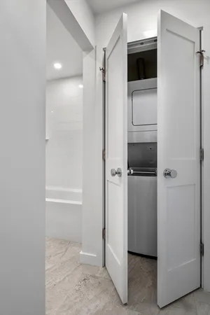 a bathroom with a granite countertop sink a toilet and bathtub