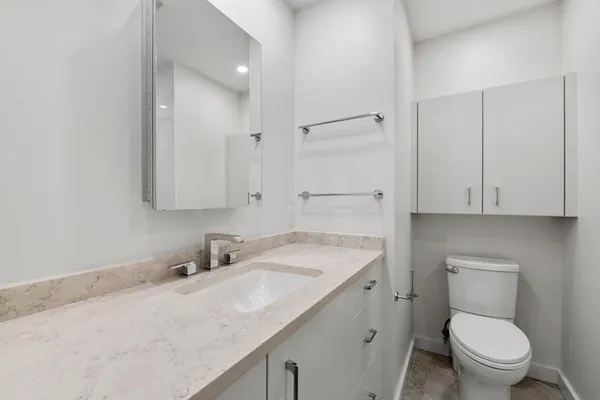 a bathroom with a bath tub with a shower