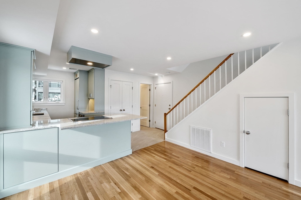 34 Constitution Way, Unit D Marblehead, MA 01945 - Photo 3 of 33 a view of a kitchen with cabinets and wooden floor