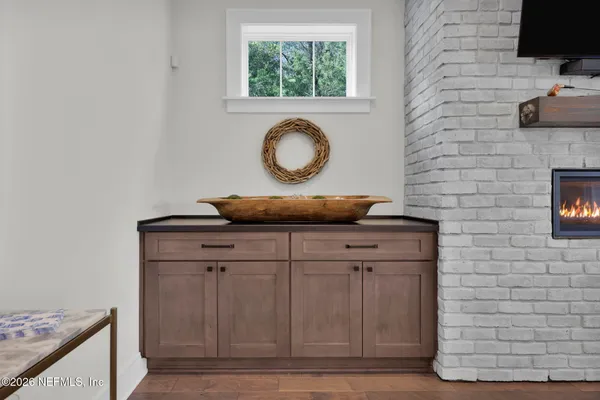 a bathroom with a sink a toilet and a window