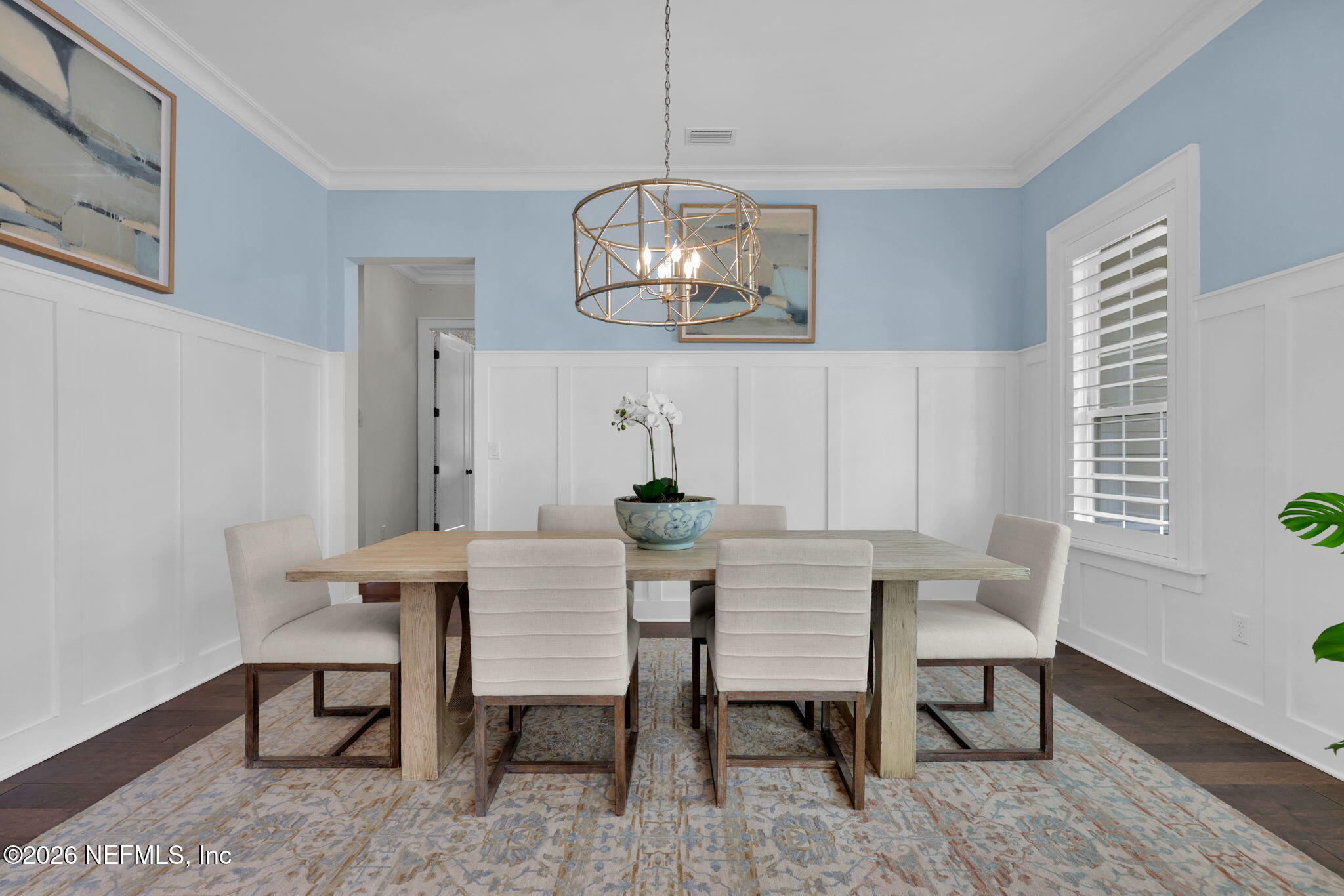 14303 Cottage Lake Road Jacksonville, FL 32224 - Photo 16 of 72 a view of a dining room with furniture a chandelier and wooden floor