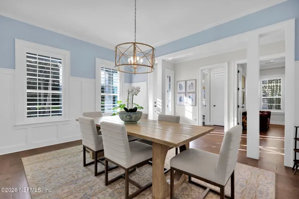 a view of a dining room with furniture and window