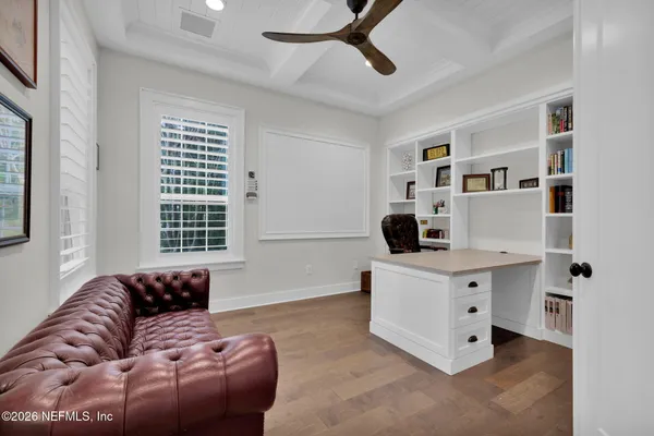 a spacious bedroom with a large bed and a couch