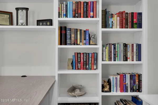 a bedroom with a large bed and a dresser