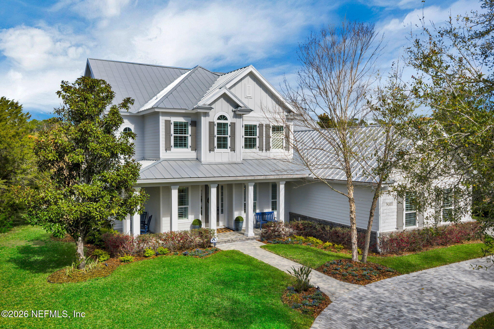 14303 Cottage Lake Road Jacksonville, FL 32224 - Photo 2 of 72 a front view of a house with a yard and porch