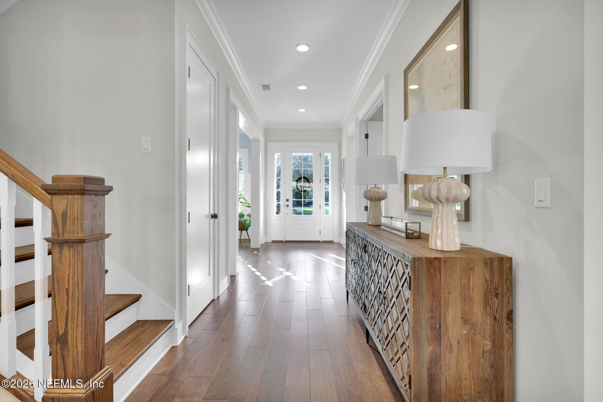 14303 Cottage Lake Road Jacksonville, FL 32224 - Photo 23 of 72 a view of a hallway with wooden floor and staircase