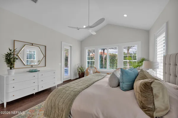a view of an entryway with wooden floor and staircase