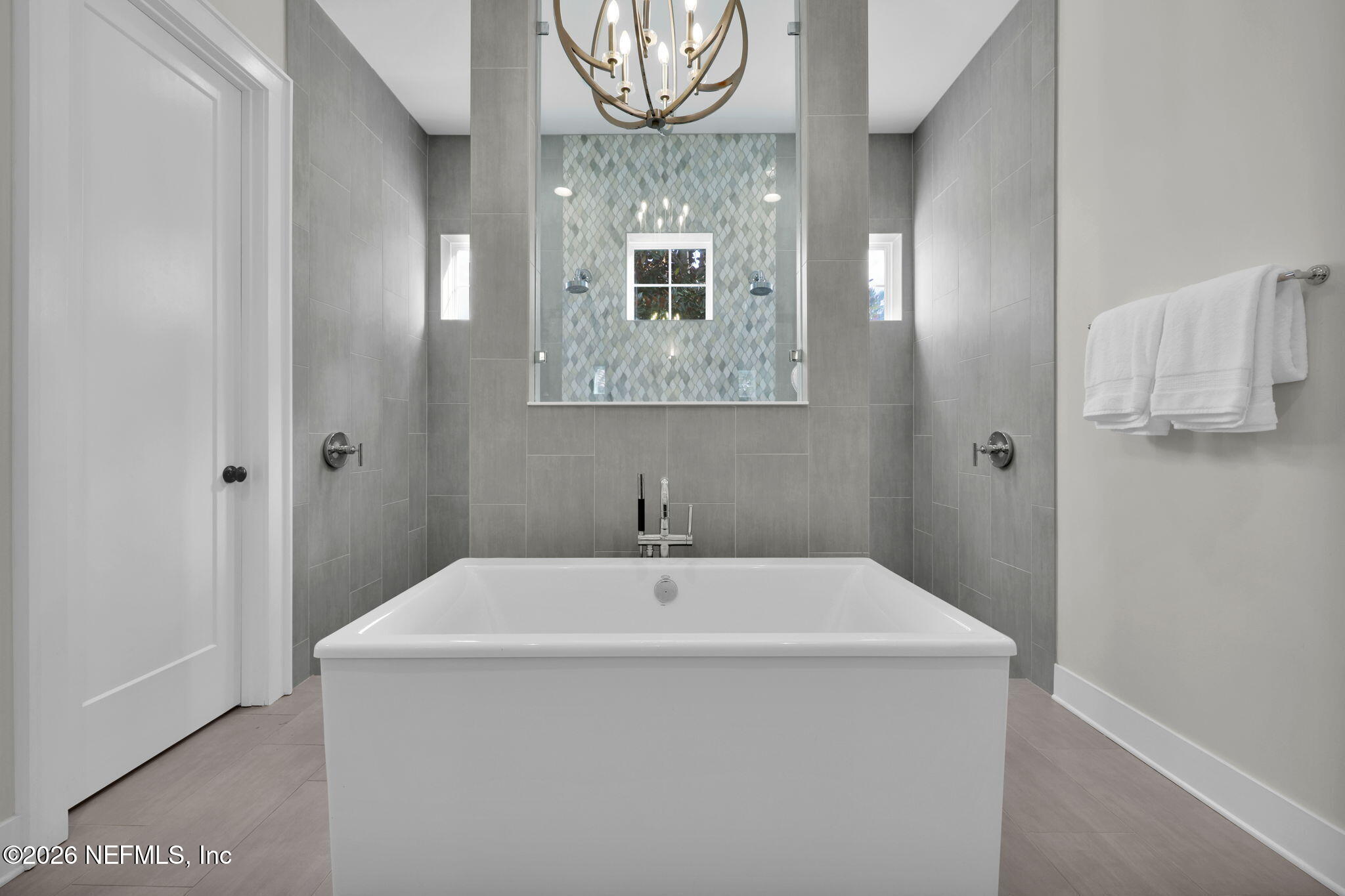 14303 Cottage Lake Road Jacksonville, FL 32224 - Photo 30 of 72 a bathroom with a sink a mirror and a window