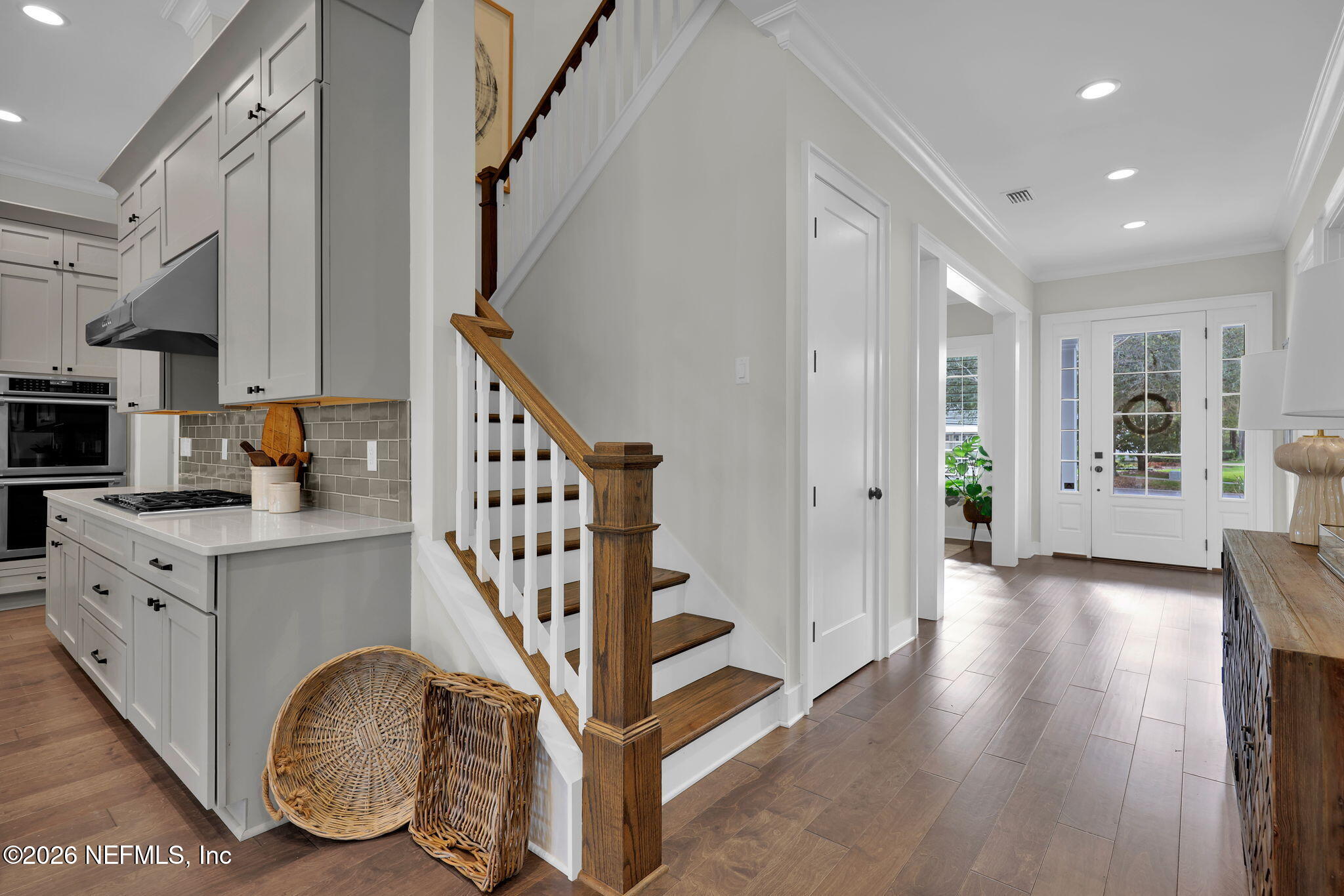 14303 Cottage Lake Road Jacksonville, FL 32224 - Photo 36 of 72 a view of an entryway with wooden floor and staircase