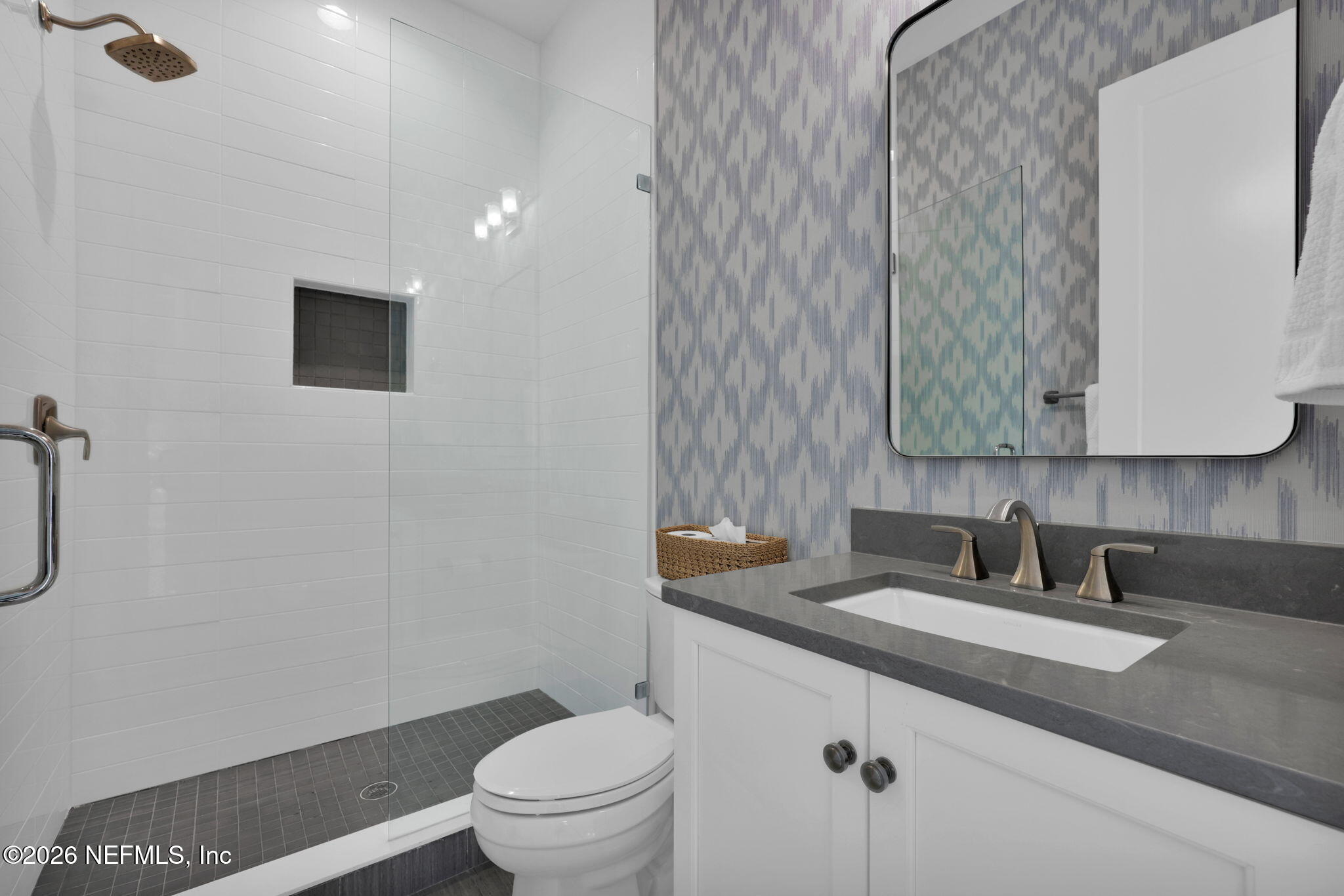 14303 Cottage Lake Road Jacksonville, FL 32224 - Photo 45 of 72 a bathroom with a granite countertop sink a toilet and a mirror