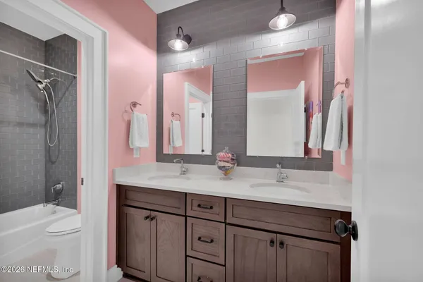 an aerial view of a houses with a lake view