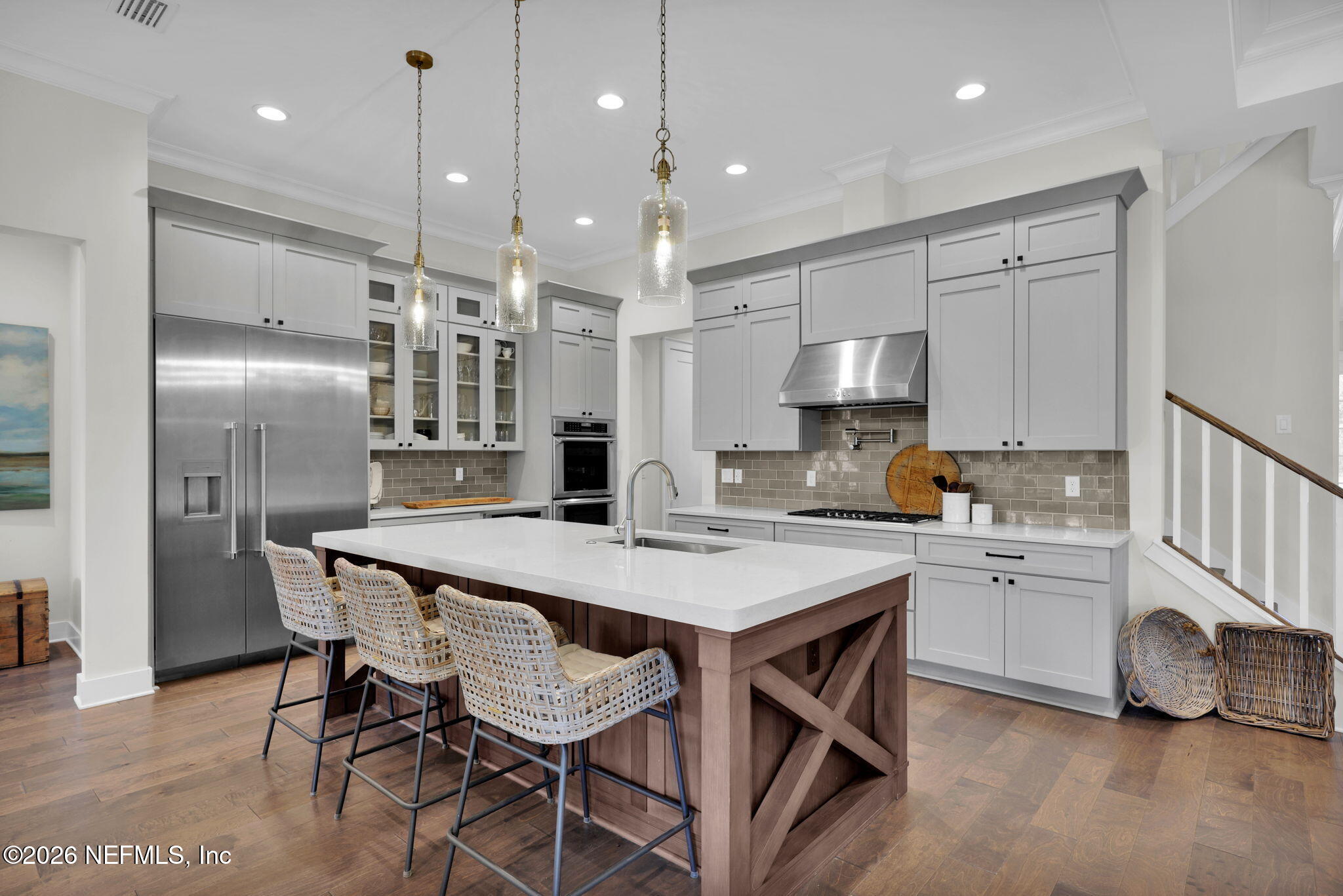 14303 Cottage Lake Road Jacksonville, FL 32224 - Photo 5 of 72 a kitchen with refrigerator cabinets dining table and chairs