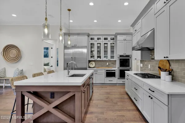 a living room with fireplace furniture and a flat screen tv