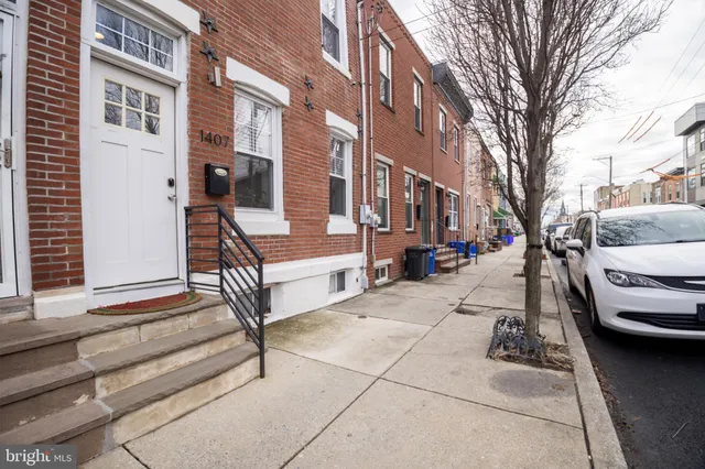 a view of a patio with a yard