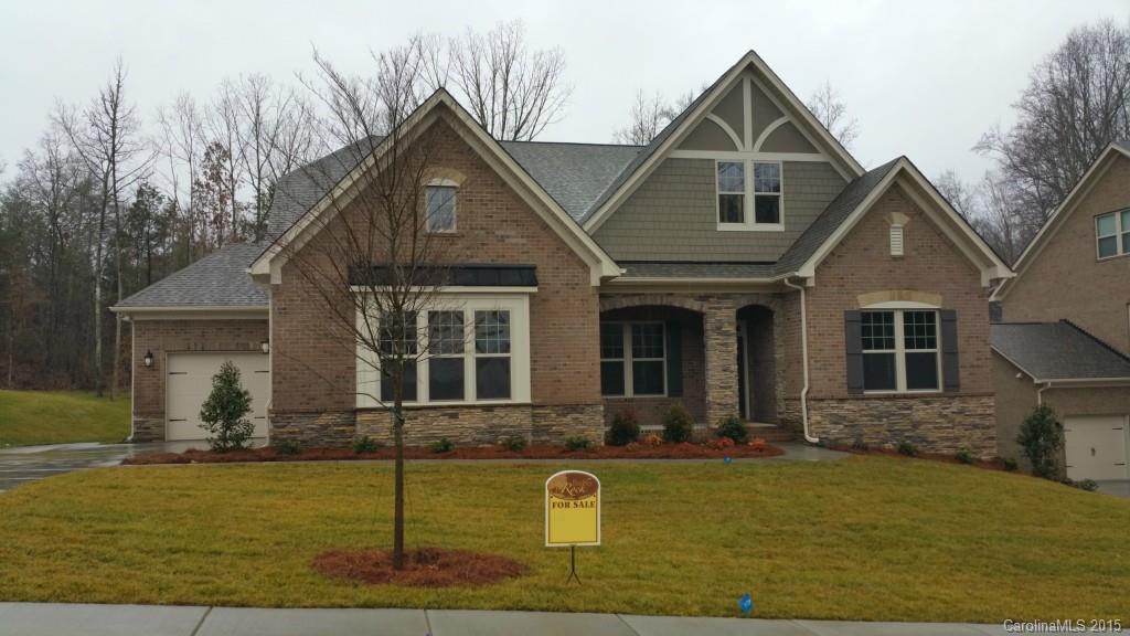 8009 Clems Branch Road Indian Land, SC 29707 - Photo 1 of 11 a front view of a house with garden