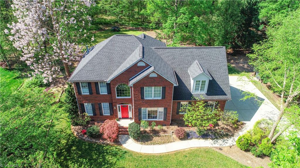 8305 Case Ridge Drive Oak Ridge, NC 27310 - Photo 2 of 48 This beautiful home has almost 1 acre surrounding it.