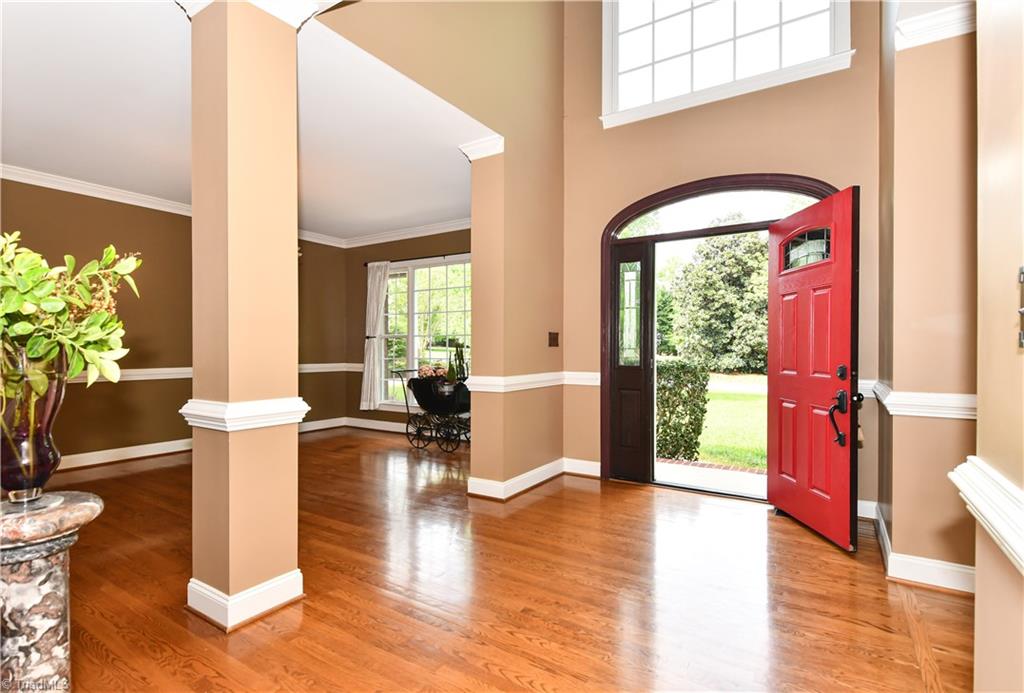 8305 Case Ridge Drive Oak Ridge, NC 27310 - Photo 11 of 48 Dramatic entry is stunning for entertaining groups.