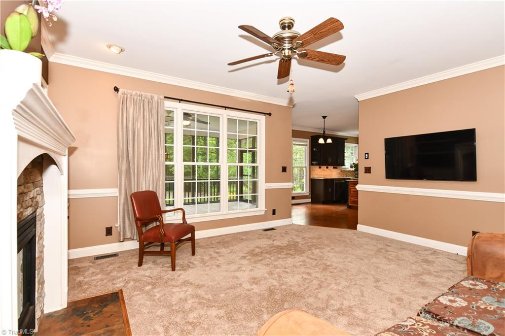 8305 Case Ridge Drive Oak Ridge, NC 27310 - Photo 16 of 48 Den leads into breakfast room and kitchen area for a more open concept.