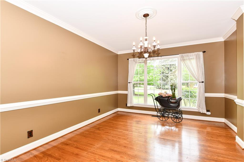 8305 Case Ridge Drive Oak Ridge, NC 27310 - Photo 26 of 48 Beautiful Dining Room with crown molding and chair railing.
