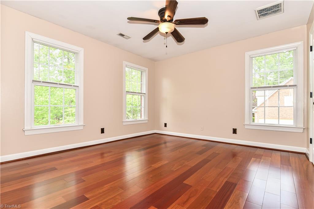 8305 Case Ridge Drive Oak Ridge, NC 27310 - Photo 29 of 48 Bedroom 2 has beautiful flooring and lots of natural light.