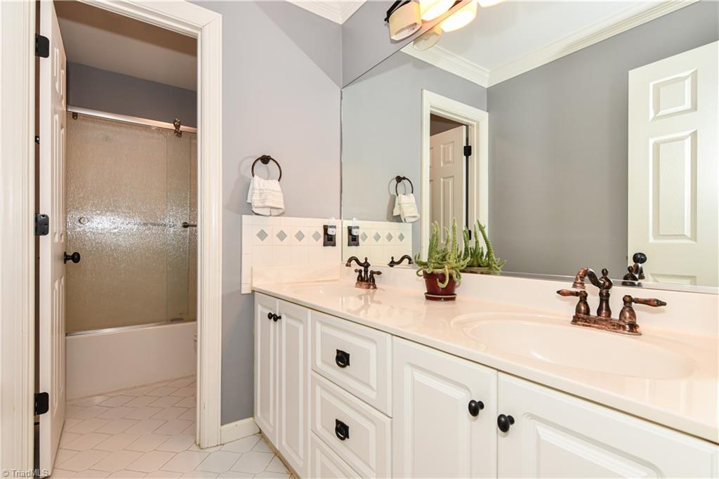 8305 Case Ridge Drive Oak Ridge, NC 27310 - Photo 33 of 48 Spacious hall bath with double vanities.