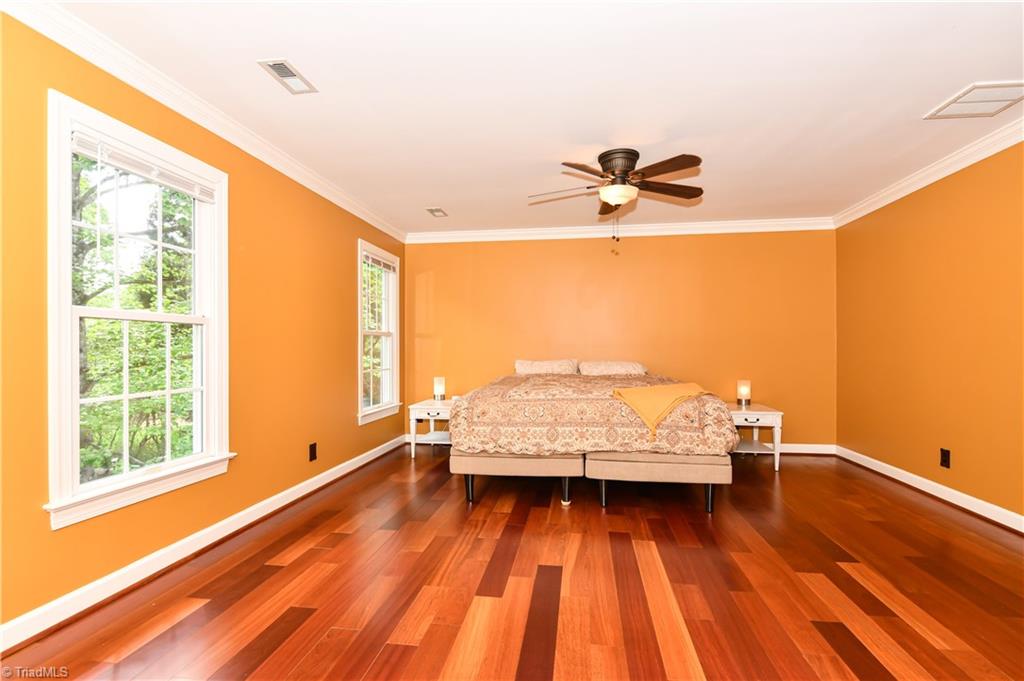 8305 Case Ridge Drive Oak Ridge, NC 27310 - Photo 34 of 48 Master/Primary is bright and spacious, with gorgeous Brazilian Cherry hardwoods.