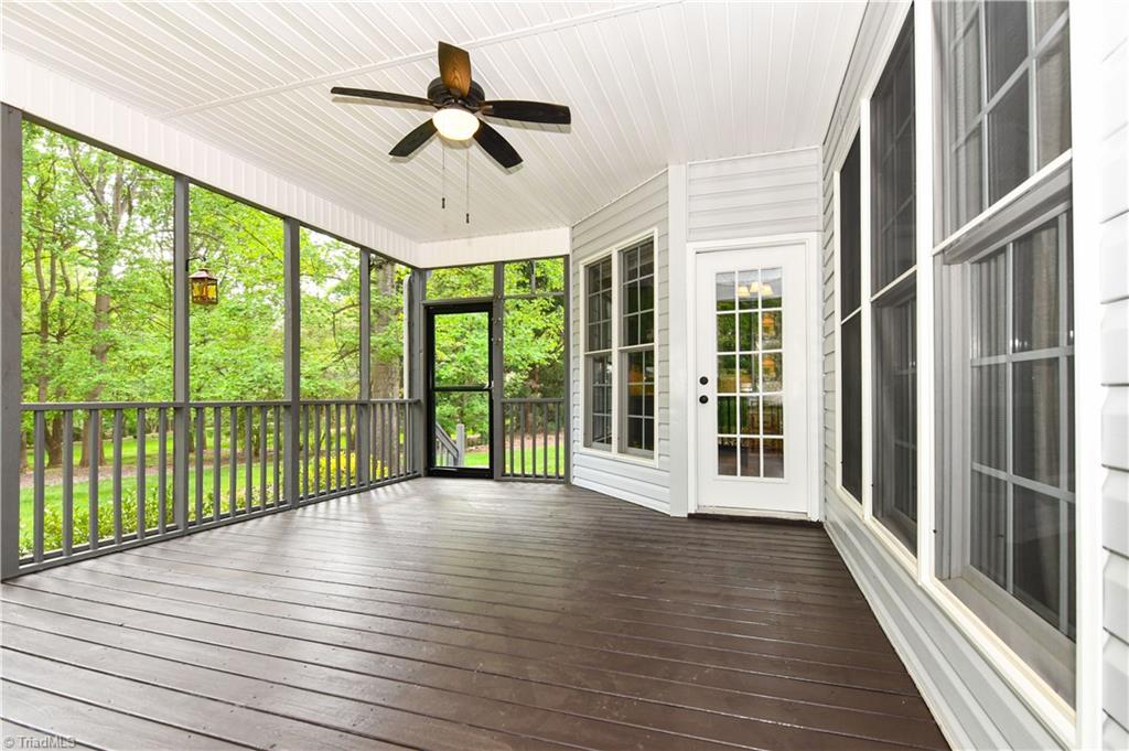8305 Case Ridge Drive Oak Ridge, NC 27310 - Photo 41 of 48 The 3 Seasons screened porch is THE place to gather.