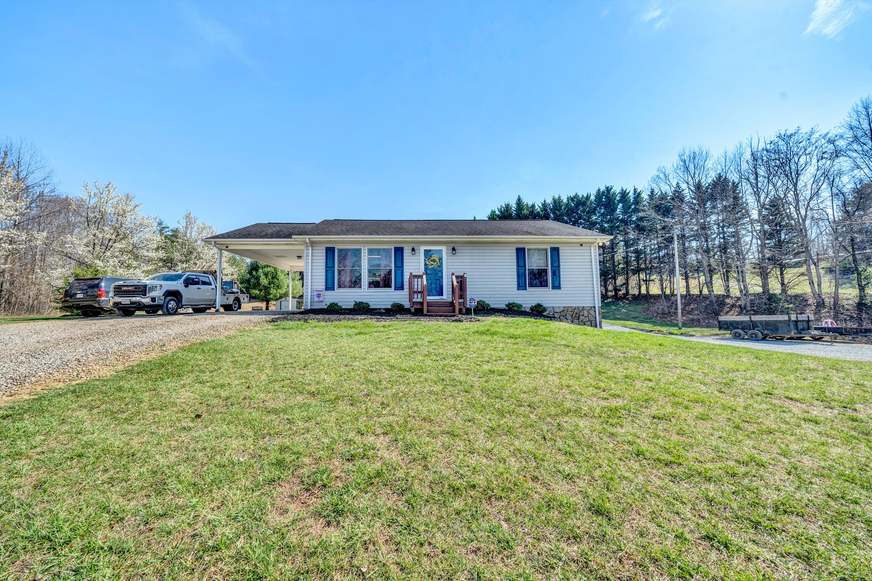 12614 Henry Road Henry, VA 24102 - Photo 33 of 34 a view of a house with a yard and sitting area