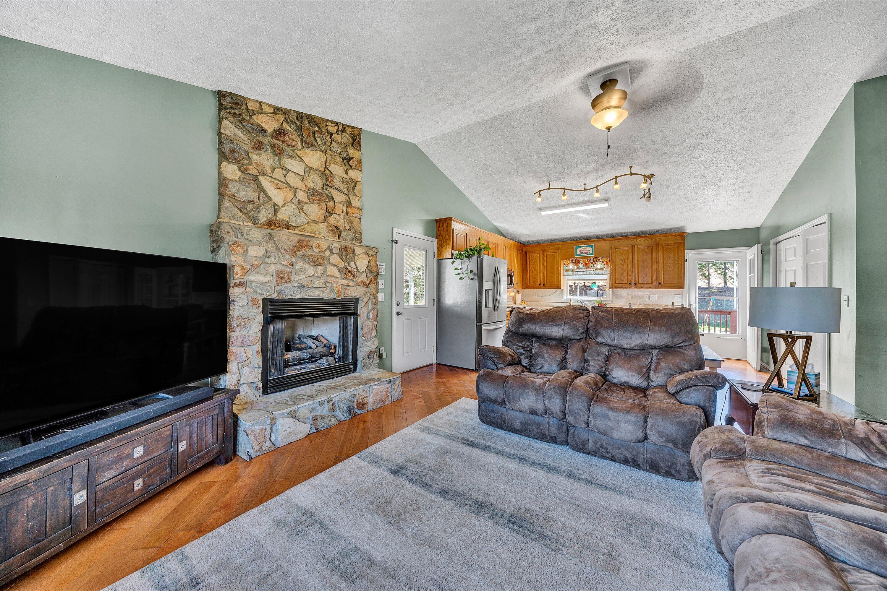 12614 Henry Road Henry, VA 24102 - Photo 4 of 34 a living room with furniture and a flat screen tv
