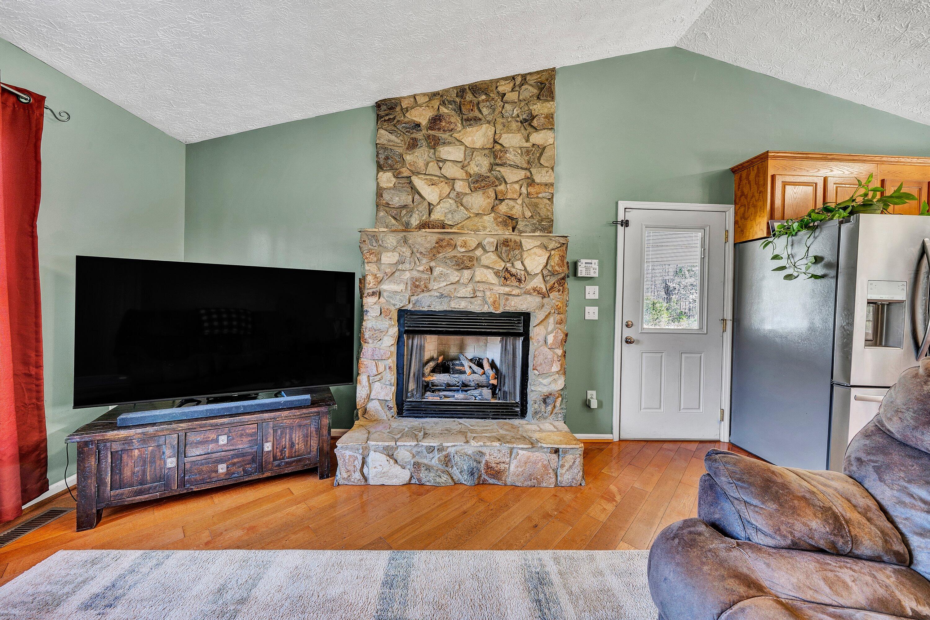 12614 Henry Road Henry, VA 24102 - Photo 6 of 34 a living room with furniture and a flat screen tv