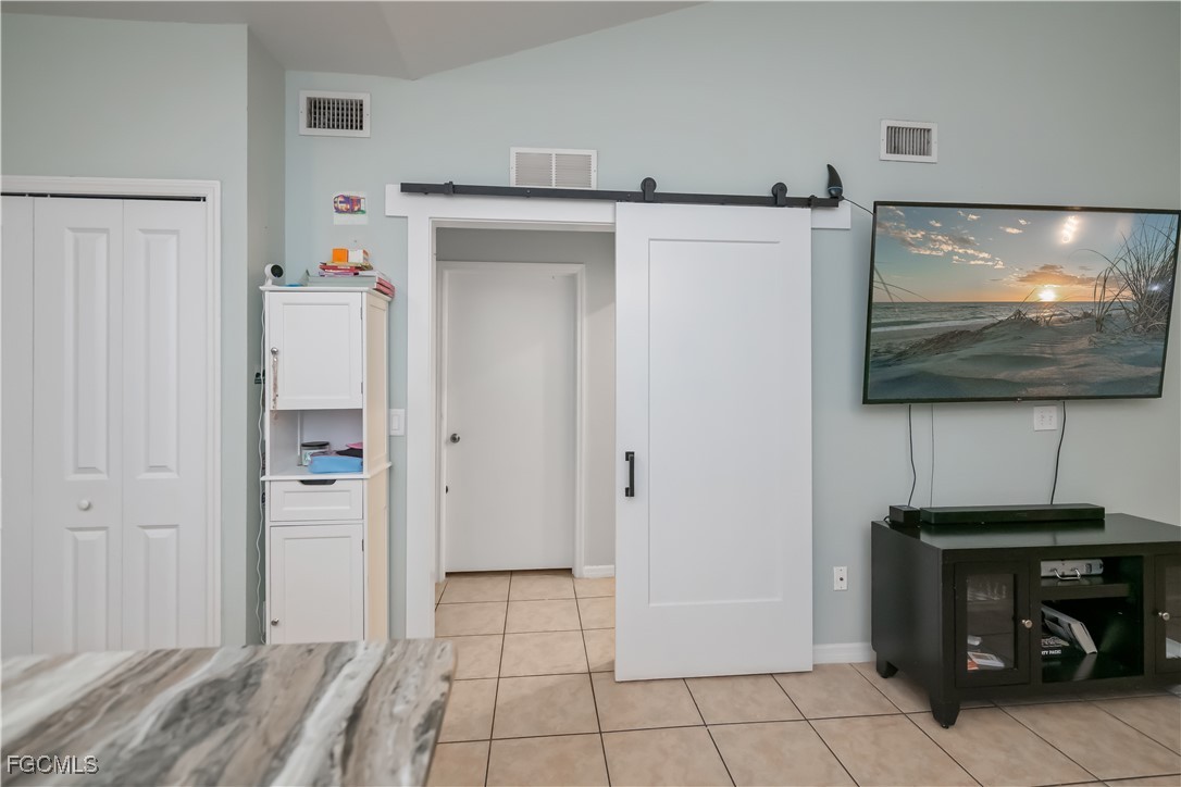 8513 Bernwood Cove Loop, Unit 212 Fort Myers, FL 33966 - Photo 13 of 43 a view of a livingroom with wooden floor and cabinet