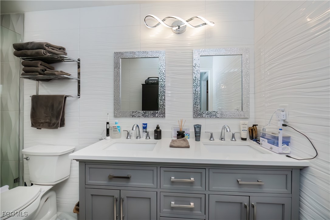 8513 Bernwood Cove Loop, Unit 212 Fort Myers, FL 33966 - Photo 18 of 43 a bathroom with a sink and a mirror