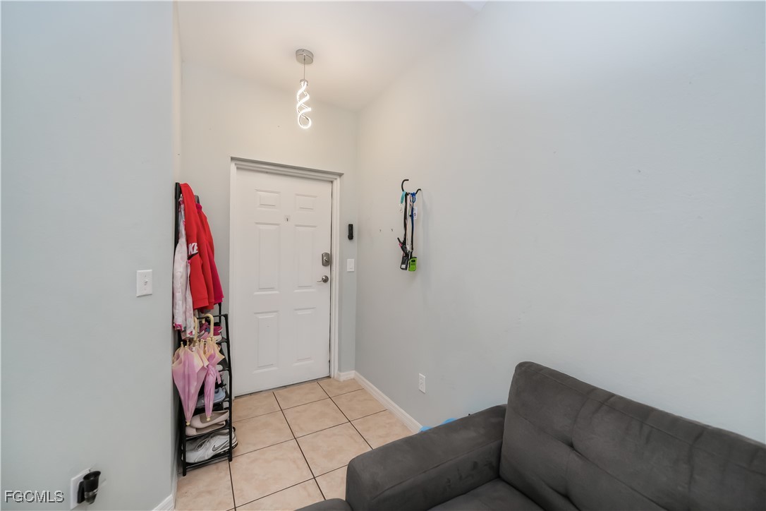 8513 Bernwood Cove Loop, Unit 212 Fort Myers, FL 33966 - Photo 2 of 43 a living room with a couch and a walk in closet