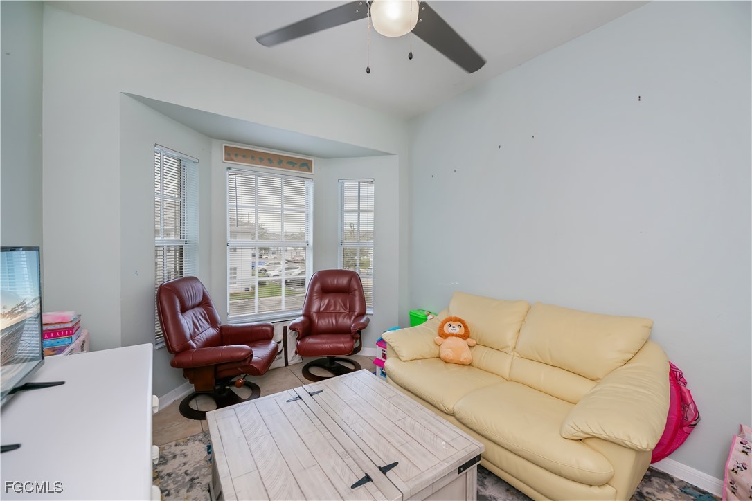 8513 Bernwood Cove Loop, Unit 212 Fort Myers, FL 33966 - Photo 27 of 43 a living room with furniture