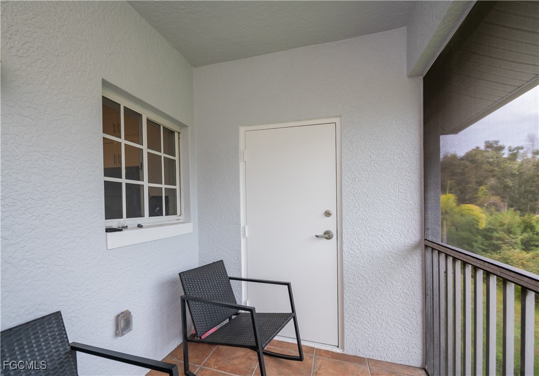 8513 Bernwood Cove Loop, Unit 212 Fort Myers, FL 33966 - Photo 35 of 43 a view of a livingroom with furniture and window