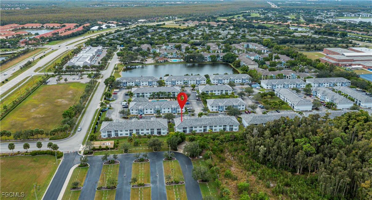 8513 Bernwood Cove Loop, Unit 212 Fort Myers, FL 33966 - Photo 39 of 43 an aerial view of residential houses with outdoor space