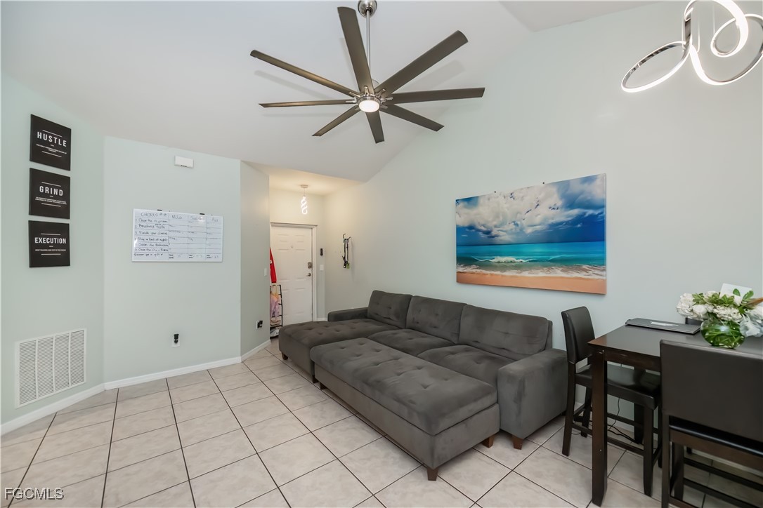 8513 Bernwood Cove Loop, Unit 212 Fort Myers, FL 33966 - Photo 5 of 43 a living room with furniture and a ceiling fan