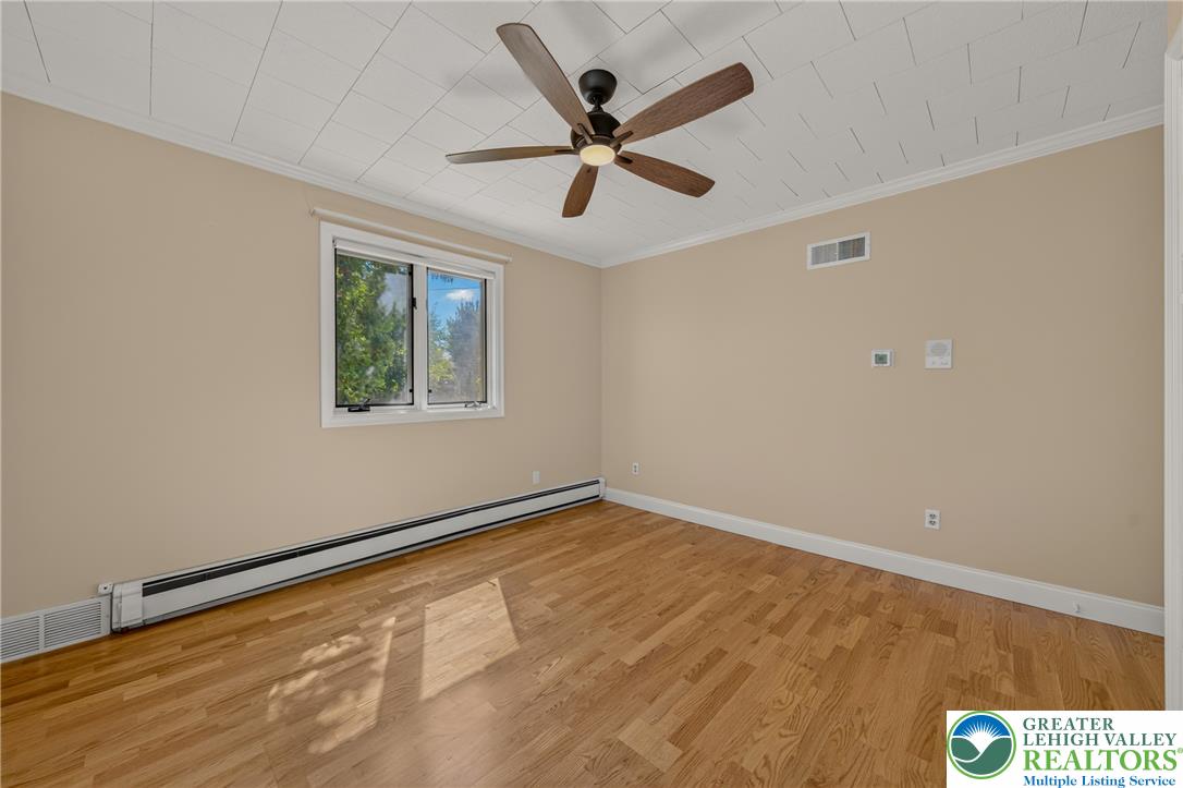 1814 Ruth Street Allentown, PA 18104 - Photo 27 of 54 Rich hardwood floors and a tiled ceiling detail define this versatile bedroom space.