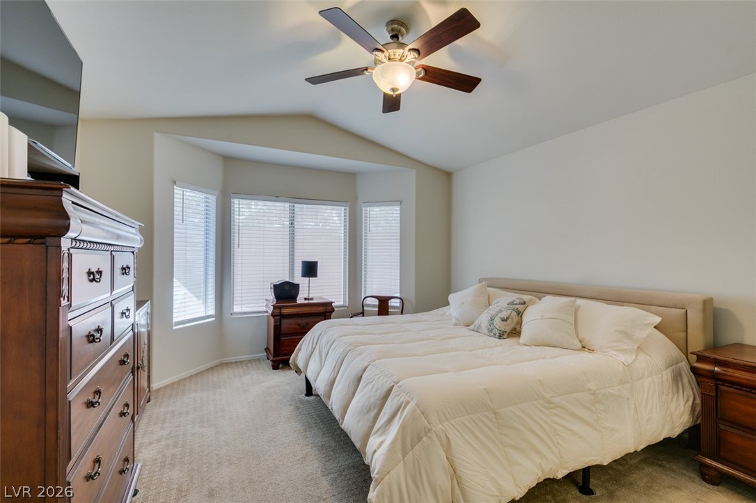 2187 Chapman Ranch Drive Henderson, NV 89012 - Photo 16 of 26 This spacious bedroom offers ample natural light and comfortable carpeting throughout.